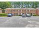 Spacious townhouse complex with ample parking surrounded by lush green trees at 302 Springview Ln # 7, Summerville, SC 29485