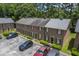 Exterior view of brick townhomes with parking, showcasing well-maintained grounds and architecture at 302 Springview Ln # 7, Summerville, SC 29485