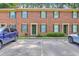 Charming brick townhouse with green shutters and well-maintained landscaping at 302 Springview Ln # 7, Summerville, SC 29485