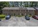 Exterior view of brick townhomes with parking, showing the facade and outdoor space at 302 Springview Ln # 7, Summerville, SC 29485