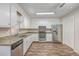 Bright kitchen featuring white cabinets, stainless steel appliances, and granite countertops at 302 Springview Ln # 7, Summerville, SC 29485