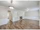 Open living space with hardwood floors, fireplace, and a view to the entryway at 302 Springview Ln # 7, Summerville, SC 29485