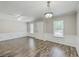 Spacious living area with hardwood floors, ceiling fan and natural light at 302 Springview Ln # 7, Summerville, SC 29485