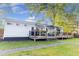 Backyard deck with awning, ideal for outdoor lounging with a view of the well-manicured lawn at 3435 Hobson Dr, Johns Island, SC 29455