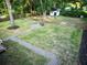 Spacious backyard featuring a cozy fire pit area and well-maintained lawn, ideal for relaxation at 3435 Hobson Dr, Johns Island, SC 29455