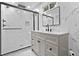 Elegant bathroom featuring marble walls, a glass-enclosed shower, and a modern vanity at 3435 Hobson Dr, Johns Island, SC 29455