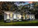 Charming home featuring a well-manicured lawn, stylish planters, and modern black-framed windows at 3435 Hobson Dr, Johns Island, SC 29455
