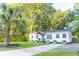 Beautifully landscaped home with green lawn and mature trees at 3435 Hobson Dr, Johns Island, SC 29455