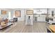 Open floor plan shows the connection of the living room with the eat in kitchen and stainless appliances at 3435 Hobson Dr, Johns Island, SC 29455