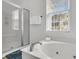 Bright bathroom featuring a jacuzzi-style tub and separate glass enclosed shower, perfect for a relaxing experience at 3513 Flowering Oak Way, Mount Pleasant, SC 29466
