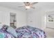 Comfortable bedroom with patterned bedding, neutral walls, carpet flooring, and a ceiling fan at 3513 Flowering Oak Way, Mount Pleasant, SC 29466