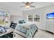 Cozy bedroom with natural light, neutral walls, carpet flooring, and a comfortable bed with a desk workspace at 3513 Flowering Oak Way, Mount Pleasant, SC 29466
