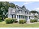 Charming home exterior with manicured lawn and inviting front porch at 3513 Flowering Oak Way, Mount Pleasant, SC 29466