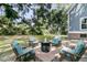 Cozy outdoor firepit with chairs, perfect for entertaining in a charming and serene backyard setting at 3513 Flowering Oak Way, Mount Pleasant, SC 29466