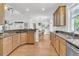 Spacious kitchen with hardwood floors, stainless steel appliances and granite counter tops at 3513 Flowering Oak Way, Mount Pleasant, SC 29466