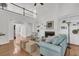 Open floor plan with living area featuring fireplace, built-in shelves, and view of the staircase, creating a welcoming space at 3513 Flowering Oak Way, Mount Pleasant, SC 29466