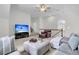 Upstairs living room featuring neutral carpeting and a large TV at 3513 Flowering Oak Way, Mount Pleasant, SC 29466