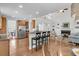 Inviting living room with hardwood floors, fireplace, and open floor plan to kitchen and dining at 3513 Flowering Oak Way, Mount Pleasant, SC 29466