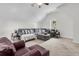 Cozy upstairs living room featuring neutral carpeting and a large sectional couch at 3513 Flowering Oak Way, Mount Pleasant, SC 29466