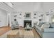 Spacious living room showcasing a fireplace, built-in shelves, and comfortable seating, creating a welcoming atmosphere at 3513 Flowering Oak Way, Mount Pleasant, SC 29466