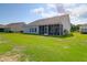 Spacious backyard featuring a screened-in porch, offering a comfortable outdoor living space at 3524 Great Egret Dr, Johns Island, SC 29455