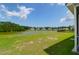 Expansive backyard with a lush lawn and a serene lake view, perfect for outdoor activities at 3524 Great Egret Dr, Johns Island, SC 29455