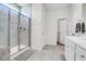 Bright bathroom boasts a glass enclosed tile shower and white cabinets and trim at 3524 Great Egret Dr, Johns Island, SC 29455