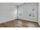 This well lit bedroom features white trim, wood-look floors and great natural light at 3524 Great Egret Dr, Johns Island, SC 29455