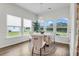Charming breakfast area with large windows, a round table, and elegant decor at 3524 Great Egret Dr, Johns Island, SC 29455