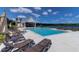 Inviting community pool area with lounge chairs, umbrellas, and picturesque lake views at 3524 Great Egret Dr, Johns Island, SC 29455