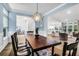 Well-lit dining room featuring elegant lighting and comfortable seating at 3524 Great Egret Dr, Johns Island, SC 29455