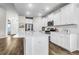 Modern kitchen featuring white cabinets, quartz countertops, and stainless steel appliances at 3524 Great Egret Dr, Johns Island, SC 29455