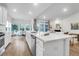 Bright, open kitchen with stainless steel appliances, large island, and adjacent dining area at 3524 Great Egret Dr, Johns Island, SC 29455