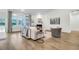 Bright living area with fireplace, large windows, and hardwood flooring at 3524 Great Egret Dr, Johns Island, SC 29455