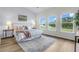 Bright main bedroom has a soft rug, a comfortable bed and a view of the water at 3524 Great Egret Dr, Johns Island, SC 29455
