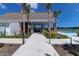 Relaxing poolside pavilion with palm trees, offering a shaded area for residents to unwind and enjoy the views at 3524 Great Egret Dr, Johns Island, SC 29455
