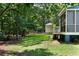 View of backyard with a screened porch and wooden fence at 3574 Toomer Kiln Cir, Mount Pleasant, SC 29466