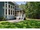Large backyard with a screened-in porch, patio, and grill perfect for enjoying time outside at 3574 Toomer Kiln Cir, Mount Pleasant, SC 29466