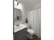 Bright bathroom with a grey vanity, modern fixtures, and a neutral color palette at 3574 Toomer Kiln Cir, Mount Pleasant, SC 29466