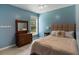 Light-filled bedroom featuring a neutral color scheme, carpet, and a decorative headboard at 3574 Toomer Kiln Cir, Mount Pleasant, SC 29466