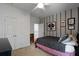 Relaxing bedroom with plush bedding, striped accent wall, and ample closet space at 3574 Toomer Kiln Cir, Mount Pleasant, SC 29466