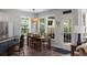 Cozy dining area with a wooden table set next to a door leading to an outside patio at 3574 Toomer Kiln Cir, Mount Pleasant, SC 29466