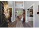 Grand foyer with soaring ceilings, hardwood floors, and a view of the elegant staircase and living spaces at 3574 Toomer Kiln Cir, Mount Pleasant, SC 29466