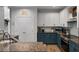 Open kitchen featuring white and blue cabinetry, granite countertops, and stainless steel appliances at 3574 Toomer Kiln Cir, Mount Pleasant, SC 29466