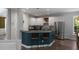 Well-lit kitchen features counter seating, stainless steel appliances, and sleek white cabinetry at 3574 Toomer Kiln Cir, Mount Pleasant, SC 29466