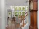 Bright and airy living room with large windows, hardwood floors, and comfortable seating area at 3574 Toomer Kiln Cir, Mount Pleasant, SC 29466