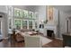 Bright living room featuring many windows, fireplace, and hardwood floors at 3574 Toomer Kiln Cir, Mount Pleasant, SC 29466