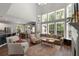 Open-concept living room filled with lots of natural light, featuring a dining and bar area at 3574 Toomer Kiln Cir, Mount Pleasant, SC 29466