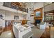 Spacious living area with fireplace and hardwood floors, open to dining area at 377 Lofton Ct, McClellanville, SC 29458