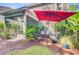 Landscaped backyard with seating area and mature trees at 3798 Sawmill Ct, Mount Pleasant, SC 29429